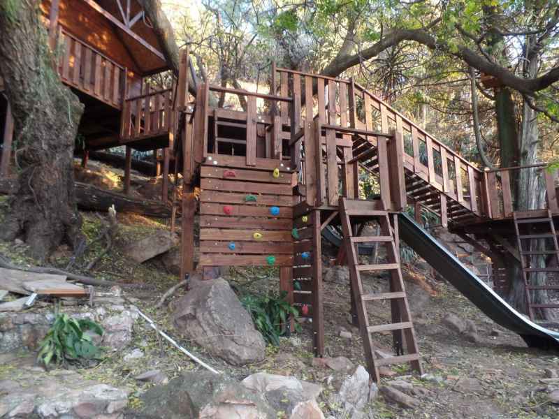 15 - Wooden Platforms around trees and grounds, with climbing walls and accessories.