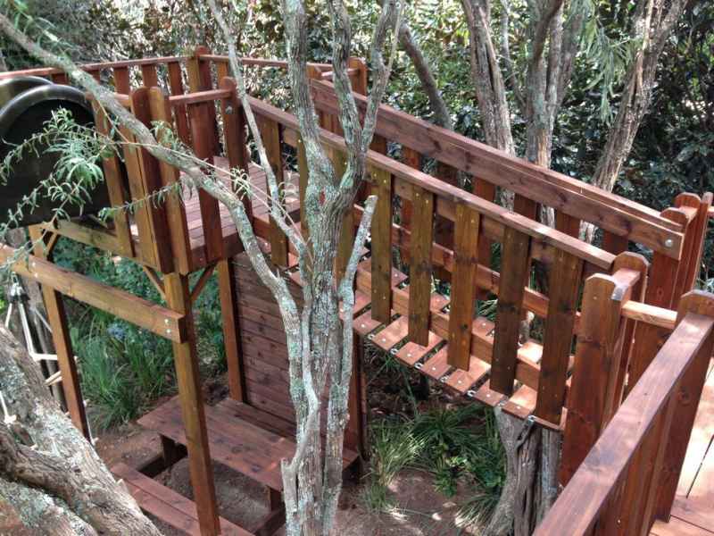 6 - Wooden Platforms in the trees with wooden Picnic Table set, Suspension Bridge, and more.